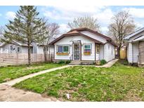 Charming single-story home with a well-maintained lawn and inviting curb appeal at 805 N Tuxedo St, Indianapolis, IN 46201