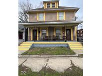 Charming home with a cozy front porch, perfect for relaxing outdoors at 114 E Palmer St, Indianapolis, IN 46225