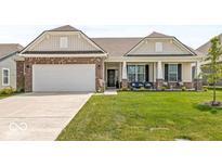 Charming single-story home with brick accents, a two-car garage, and a well-manicured front lawn at 17865 Haralson Row, Westfield, IN 46074