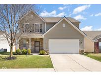Charming two-story home with a well-maintained lawn, inviting entrance, and an attached two car garage at 18900 Big Circle Dr, Noblesville, IN 46062