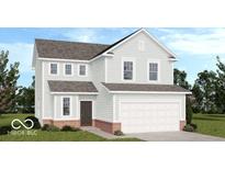 Charming two-story home with a brick-lined foundation, attached garage, and well-manicured lawn at 1952 White Oak Ln, Shelbyville, IN 46176