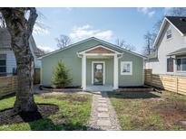 Charming home featuring new landscaping, sidewalk, and a covered entryway at 2361 Southeastern Ave, Indianapolis, IN 46201