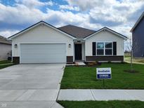 Charming single-story home with a two-car garage and well-manicured lawn at 3181 W Keepsake Ln, Monrovia, IN 46157