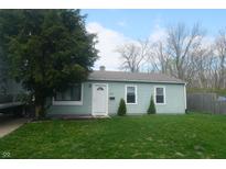 Charming single-story home with a well-maintained front yard and a classic white door at 4502 W 36Th St, Indianapolis, IN 46222