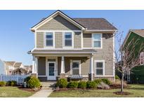 Charming two-story home featuring a covered porch, well-maintained landscaping, and classic architectural details at 6200 Bliss E Pt, Whitestown, IN 46075