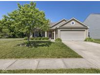 Charming single-story home featuring a well-manicured lawn and an attached two-car garage at 3002 Branch St, Whiteland, IN 46184