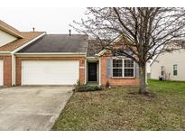 Charming single-Gathering home featuring a brick facade, attached garage and well-maintained landscaping at 6145 Crystal View Dr, Indianapolis, IN 46237