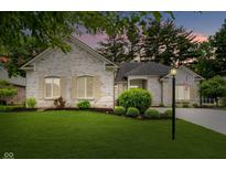 Charming brick home with manicured lawn and beautiful landscaping at 7271 Catboat Ct, Fishers, IN 46038