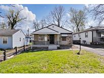 Charming single-story home featuring a stone facade, covered porch, and well-maintained lawn at 3445 N Olney St, Indianapolis, IN 46218