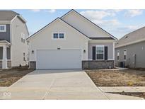 Charming single-Gathering home featuring a two-car garage and light color scheme at 5207 Rolling Meadow Blvd, Indianapolis, IN 46237
