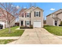 Charming two-story home featuring black shutters, a one-car garage, and a well-maintained front lawn at 8808 Hosta Way, Indianapolis, IN 46113