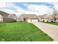 Charming single-Gathering home with well-manicured lawn, driveway and a two-car garage at 9539 Rocky Shore Dr, McCordsville, IN 46055