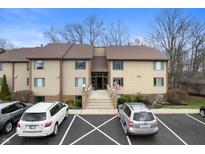 Inviting condo complex featuring classic architecture, ample parking, and a meticulously maintained landscape at 108 Knoll Ct # A, Noblesville, IN 46062
