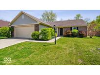 Charming single-story home with brick accents, attached garage, and a well-maintained front yard at 12741 Glengary Dr, Fishers, IN 46038