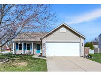 Charming single-Gathering home featuring a two-car garage, lovely front yard, and attractive curb appeal at 18875 Pilot Mills Dr, Noblesville, IN 46062