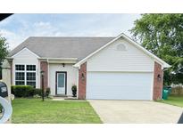 Charming single-story home with brick accents, well-manicured lawn, and a two-car garage at 4220 Tarpon Bay Dr, Noblesville, IN 46062