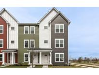 Eye-catching townhome showcases contemporary design and colorful exterior with bright white trim at 928 E 24Th St, Indianapolis, IN 46205