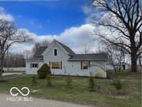 Charming two-story home with mature trees and landscaping on a spacious lot at 11522 N 450 W, Alexandria, IN 46001