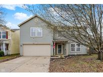 Charming two-story home with a well-maintained lawn, two car garage, and inviting front porch at 2180 Olympia Dr, Franklin, IN 46131