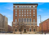 Stunning brick building featuring ornate architectural details under a bright blue sky at 350 N Meridian St # 610, Indianapolis, IN 46204