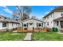 Charming single-story home with a welcoming wood porch and well-maintained lawn at 4933 Ford St, Indianapolis, IN 46224