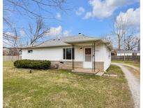 Charming one-story home featuring vinyl siding, stone accents, and a cozy front porch at 5225 S Linwood Ave, Indianapolis, IN 46237