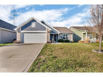 Charming single-story home with a well-manicured lawn and attached two-car garage at 972 Redwood Dr, Franklin, IN 46131