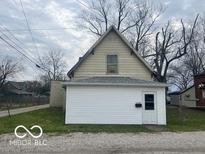 Back exterior view of the house, showing the siding and roof at 11147 Exchange St, Indianapolis, IN 46259