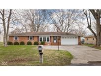 Charming brick ranch-style home with a well-manicured lawn and attached two-car garage at 4728 Southern Ave, Anderson, IN 46013