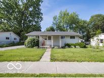 Charming single-story home featuring a well-manicured lawn and welcoming entrance at 428 E Trevor St, Brownsburg, IN 46112