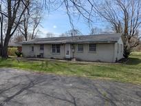 Modest one-story brick home with a cozy feel and a sprawling front yard at 5961 N 200 W, Columbus, IN 47201