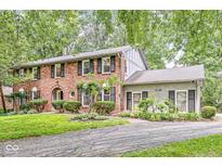 Charming brick two-story home with black shutters and manicured landscaping at 7138 Avalon Trail Ct, Indianapolis, IN 46250