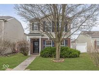 Charming two-story home with a well-maintained lawn and a welcoming brick-accented entrance at 12970 E 131St St, Fishers, IN 46037