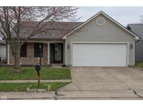 Charming single-story home featuring a well-maintained lawn and a two-car garage at 143 Tracy Ridge Blvd, Whiteland, IN 46184