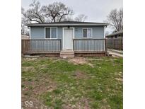 Charming home with a inviting front porch and light blue siding at 3240 Collier St, Indianapolis, IN 46221