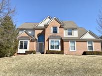 Charming two-story brick home featuring a well-maintained lawn and inviting front entrance at 3926 Castle Rock Dr, Zionsville, IN 46077