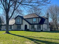 Charming two-story home featuring a well-manicured lawn, brick accents, and architectural details at 7211 Kensington Ct, Avon, IN 46123