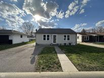 Charming single-story home featuring a well-maintained lawn and a classic exterior design with a sidewalk to the front door at 78 Irma St, Bargersville, IN 46106
