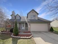 Charming two-story home with a two-car garage, brick accents, and manicured landscaping at 79 Thornburg Pkwy, Brownsburg, IN 46112