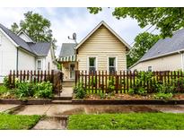 Charming single-story home featuring a lovely fenced front yard and well-maintained landscaping at 902 Villa Ave, Indianapolis, IN 46203