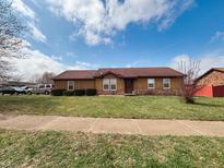 Charming single-story home with a lush green lawn and well-maintained landscaping at 1330 Ash Ct, Martinsville, IN 46151