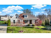 Charming two-story home featuring a stone and siding facade, well-manicured lawn, and inviting curb appeal at 15509 Slateford Rd, Noblesville, IN 46062