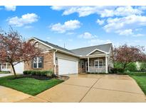 Charming single-story home with brick and siding, lush landscaping, and a well-manicured lawn at 661 Overcup St, Westfield, IN 46074