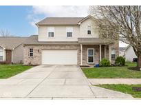 Two-story home with brick and siding, two-car garage, and a well-maintained lawn on a sunny day at 16963 Southall Dr, Westfield, IN 46074