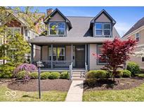 Charming home featuring a covered porch, well-manicured landscaping, and a welcoming facade at 2349 N Delaware St, Indianapolis, IN 46205