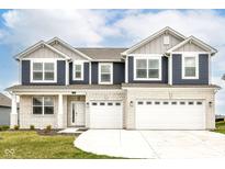 Charming two-story home with a three-car garage, brick and siding exterior and well maintained lawn at 286 Lar Lan Dr, Danville, IN 46122