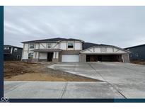 New two-story home featuring brick accents, a spacious driveway, and an attached two-car garage at 3241 Fawn Cir, Brownsburg, IN 46112