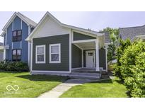 Charming single-Gathering home features new siding, white trim, and a welcoming front porch at 337 E Minnesota St, Indianapolis, IN 46225