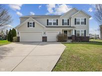 Charming two-story home featuring a two-car garage and well-maintained landscaping at 4747 Summit Lake Pl, Indianapolis, IN 46239