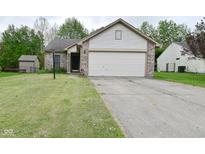 Charming one story home featuring a two car garage and a brick and vinyl facade at 5446 Lippan Way, Indianapolis, IN 46221